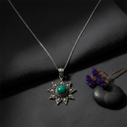 925 oxidised silver green onyx  sun pendant necklace flat lay on dark charcoal linen — handcrafted silver jewelry by CHAKORE