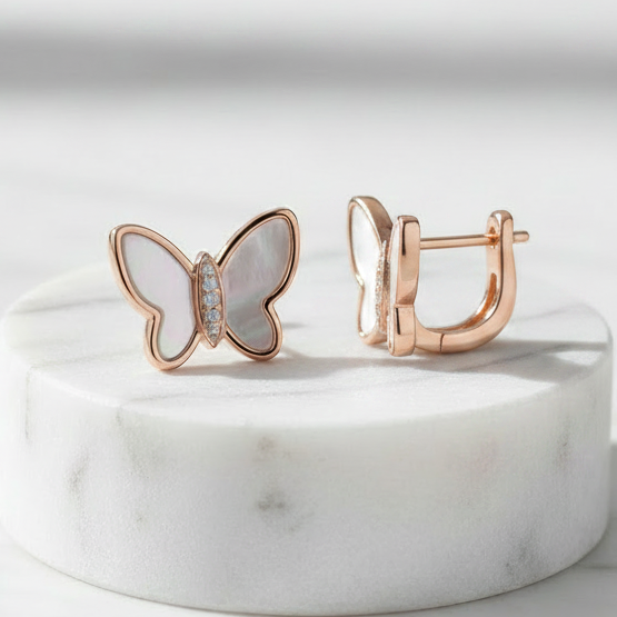 925 Sterling Silver Rose Gold Butterfly Stud Earrings – Front and Side Angle View on Marble Pedestal