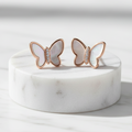 925 Sterling Silver Rose Gold Butterfly Stud Earrings with Mother of Pearl Wings – Elevated Marble Pedestal Editorial
