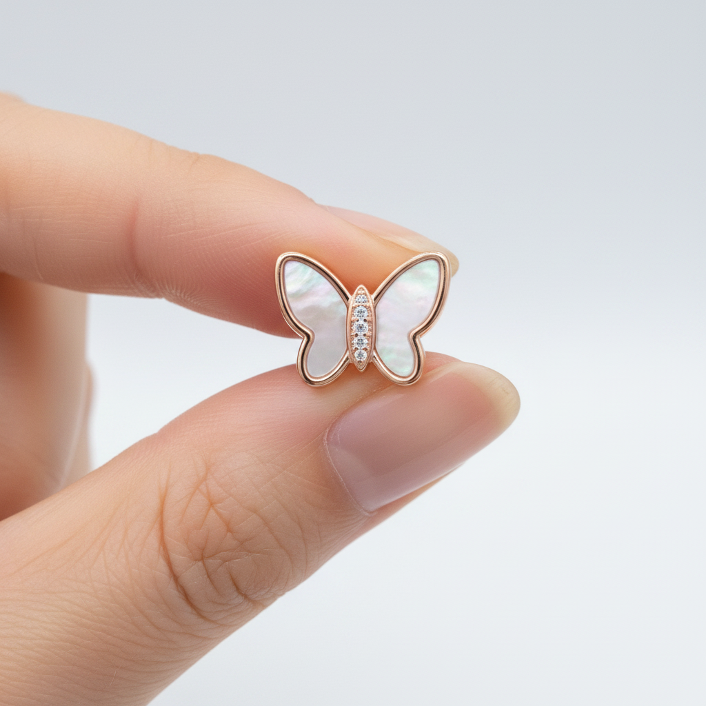 925 Sterling Silver Rose Gold Butterfly Stud Earring Held Between Fingers – Size Reference Close-Up