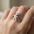 925 sterling silver adjustable floral CZ ring loosely worn on finger – lifestyle on-hand shot showing relaxed fit, editorial jewelry photography