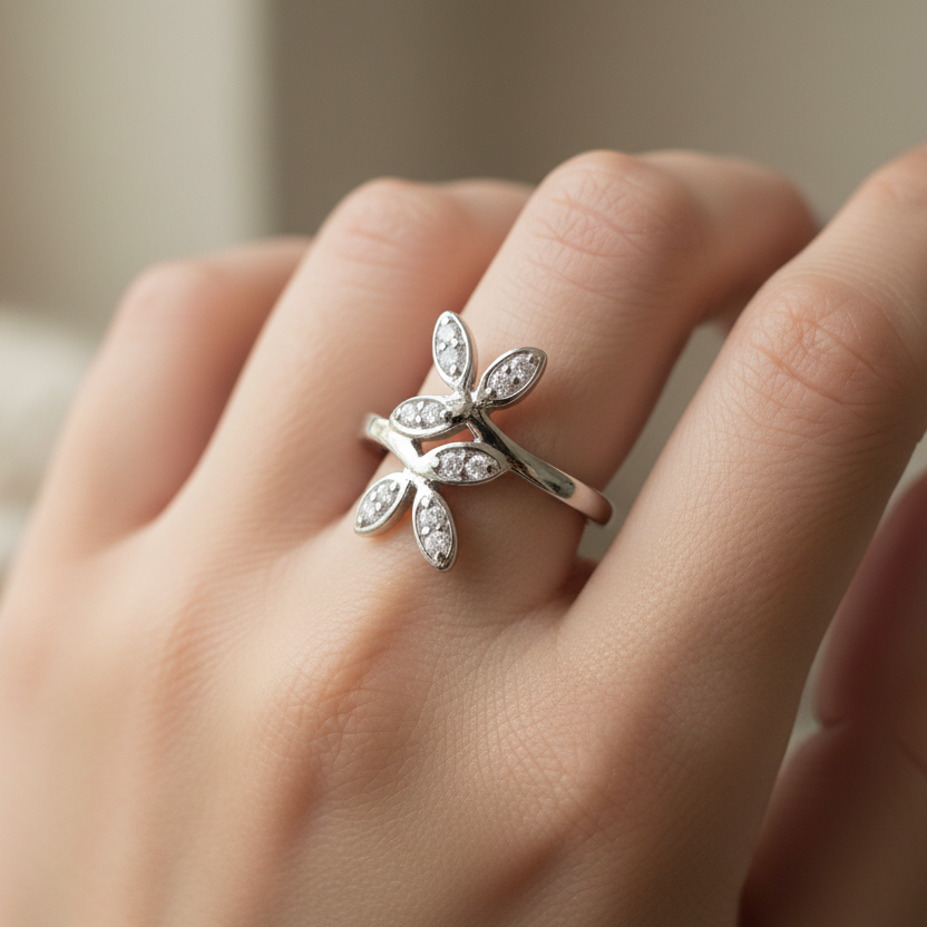 925 sterling silver adjustable floral CZ ring loosely worn on finger – lifestyle on-hand shot showing relaxed fit, editorial jewelry photography