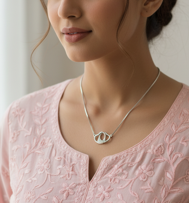 925 Sterling Silver Interlocked Hearts Necklace by CHAKORE on an Indian model  wearing Light Pink Chikankari.