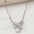925 Sterling silver mint bow necklace by CHAKORE - Flat Lay on Marble