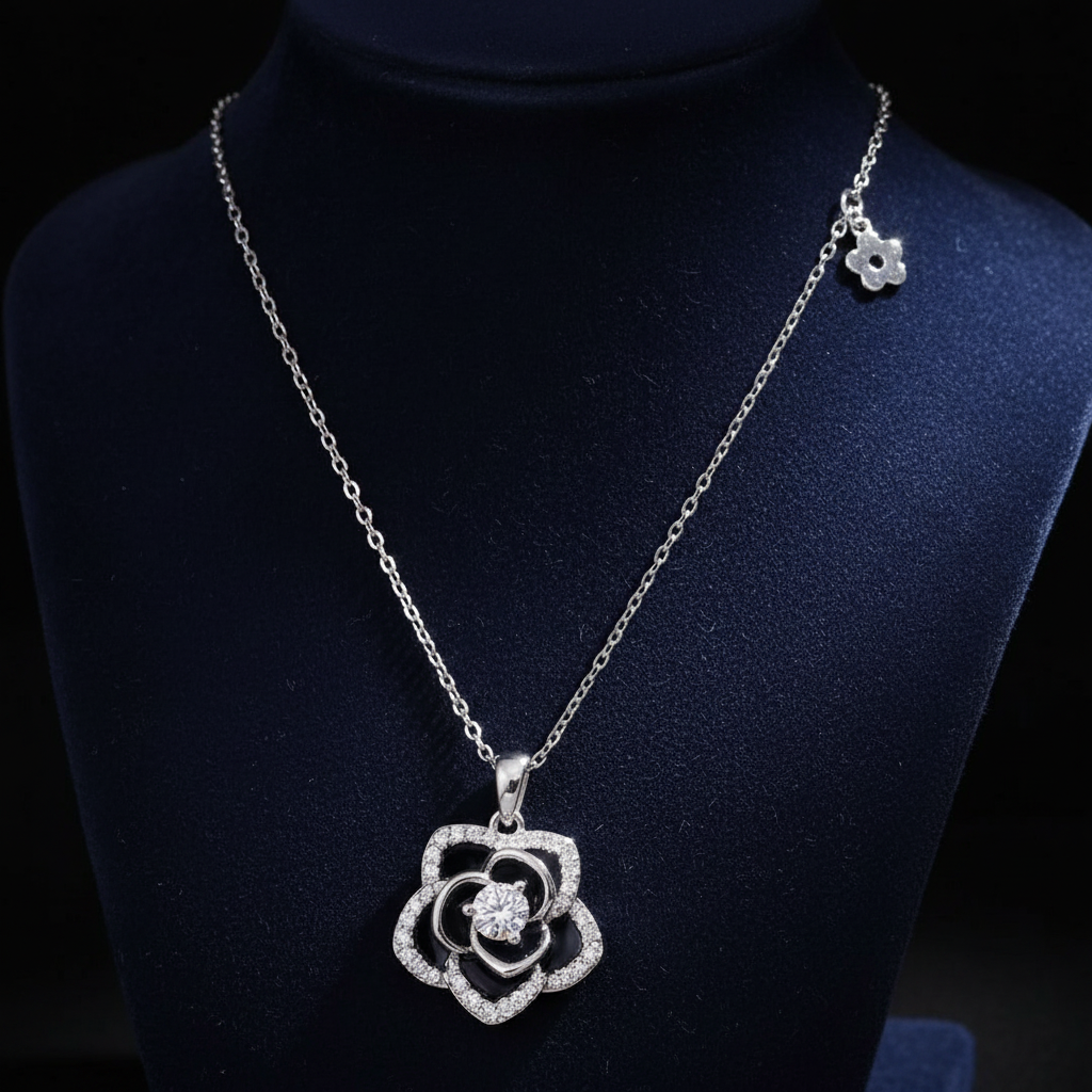 925 sterling Silver necklace with a black and sparkling cubic Zirconia Rose flower pendant  with side attached charm on Navy Velvet