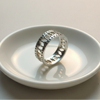 925 sterling silver wide band ring with open lattice design and pavé-set cubic zirconia stones – CHAKORE – back side 45 degree ceramic dish. Modern minimalist silver jewellery, architectural wide band ring, high-polish everyday wear. 
