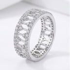 925 sterling silver wide band ring with open lattice design and pave-set cubic zirconia stones – CHAKORE – 45 angle standing. Modern minimalist silver jewellery, architectural wide band ring, high-polish everyday wear.