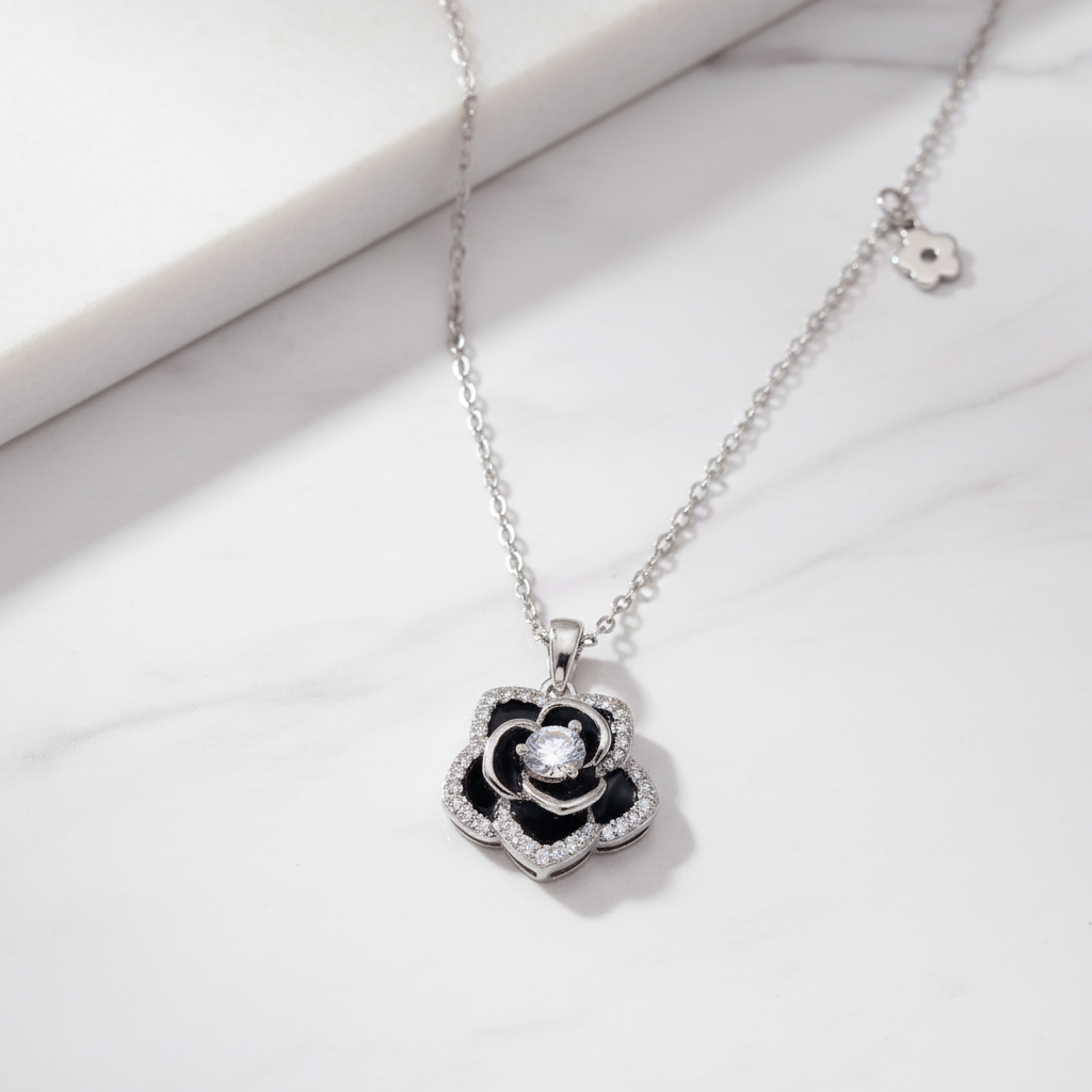 Black Rosette 925 Sterling Silver Necklace on white marble surface – CHAKORE