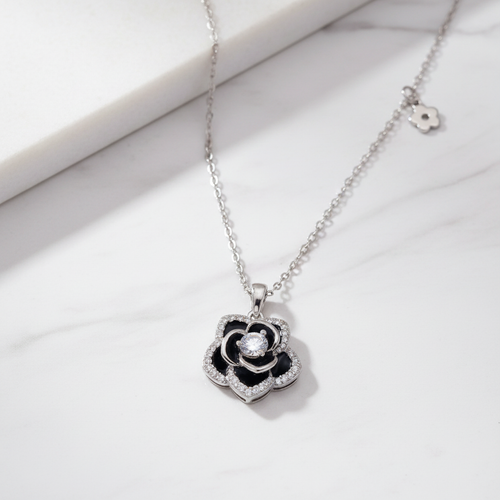 Black Rosette 925 Sterling Silver Necklace on white marble surface – CHAKORE