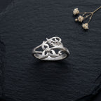 925 botanical wrap Silver ring by CHAKORE with floral design on a dark textured surface