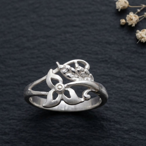 925 botanical wrap Silver ring by CHAKORE with floral design on a dark textured surface