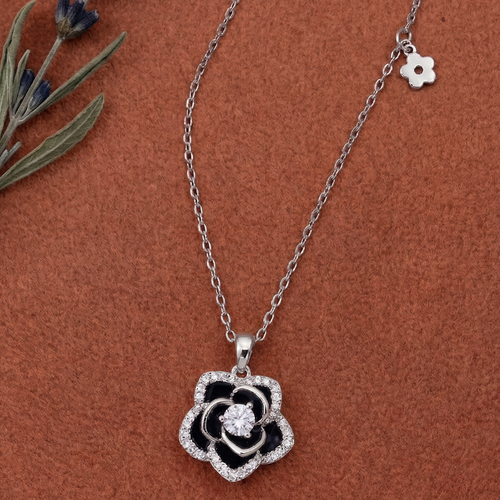925 sterling Silver necklace with a black and sparkling cubic Zirconia Rose flower pendant  with side attached charm on a brown background