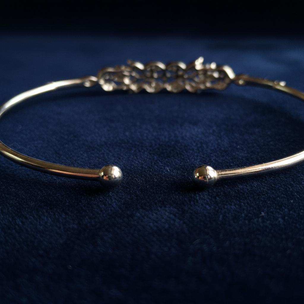 Close-up of Blush Bloom Cuff 925 sterling silver open-cuff bangle ball-end terminals showing adjustable cuff design.