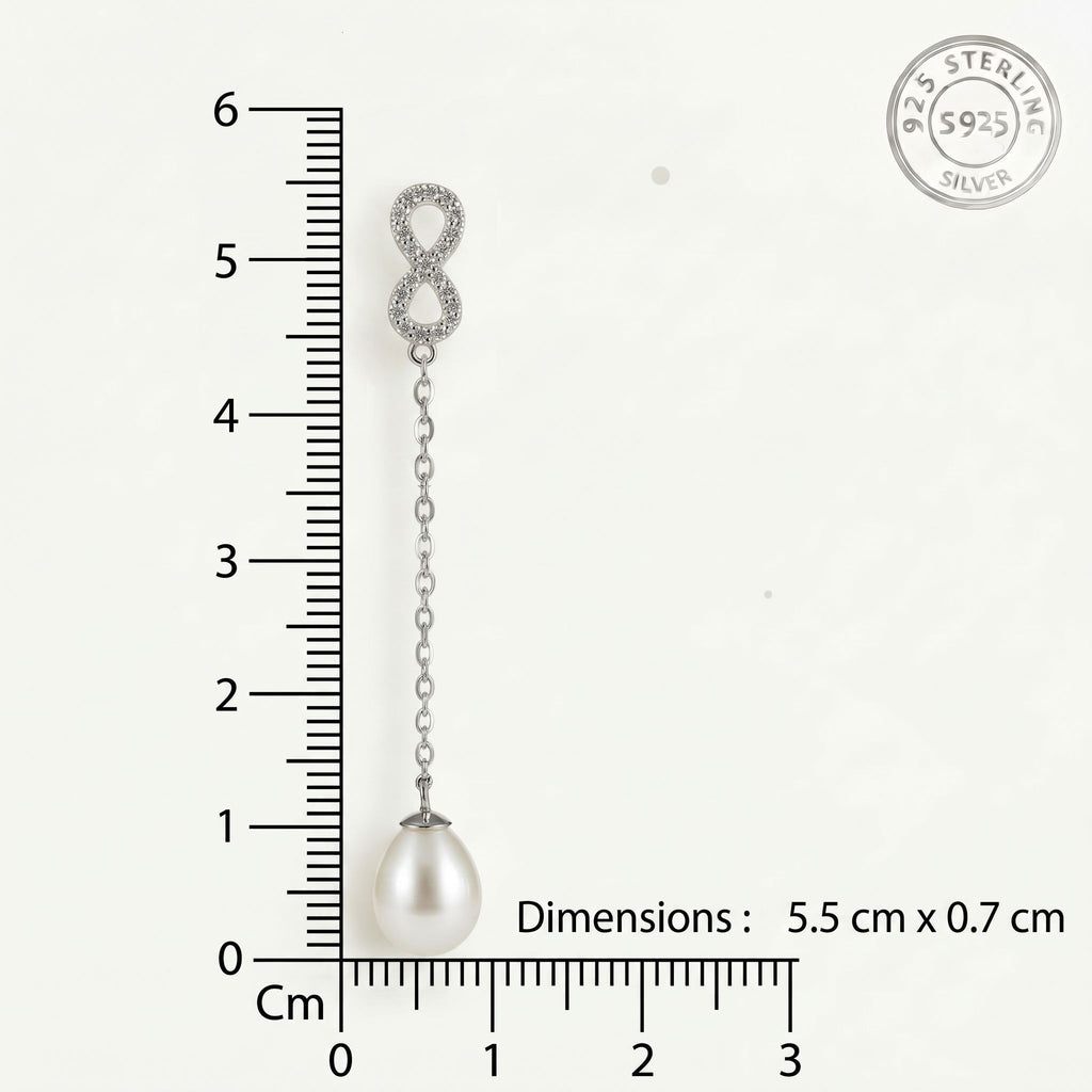 CHAKORE 925 sterling silver infinity freshwater pearl earring beside a centimetre ruler on white, labelled 5.5 cm by 0.7 cm