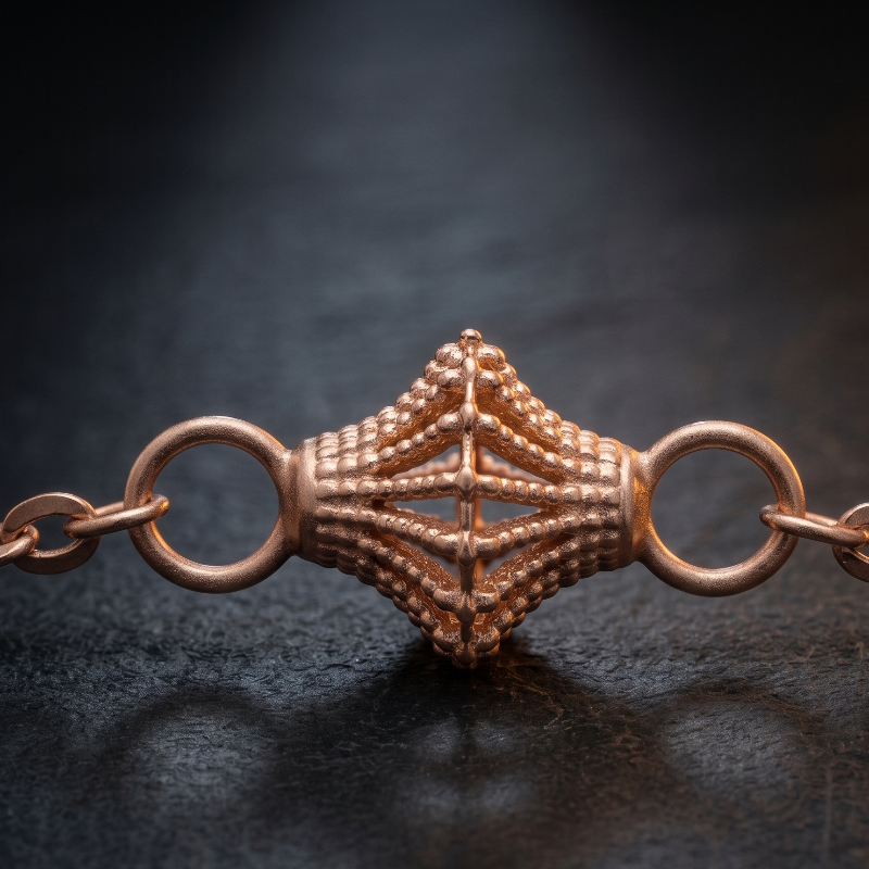 A close-up of a chakore's 925 silver rose gold chain lantern bracelet featuring a textured, diamond-shaped central clasp with two side rings, resting on a dark, reflective surface.