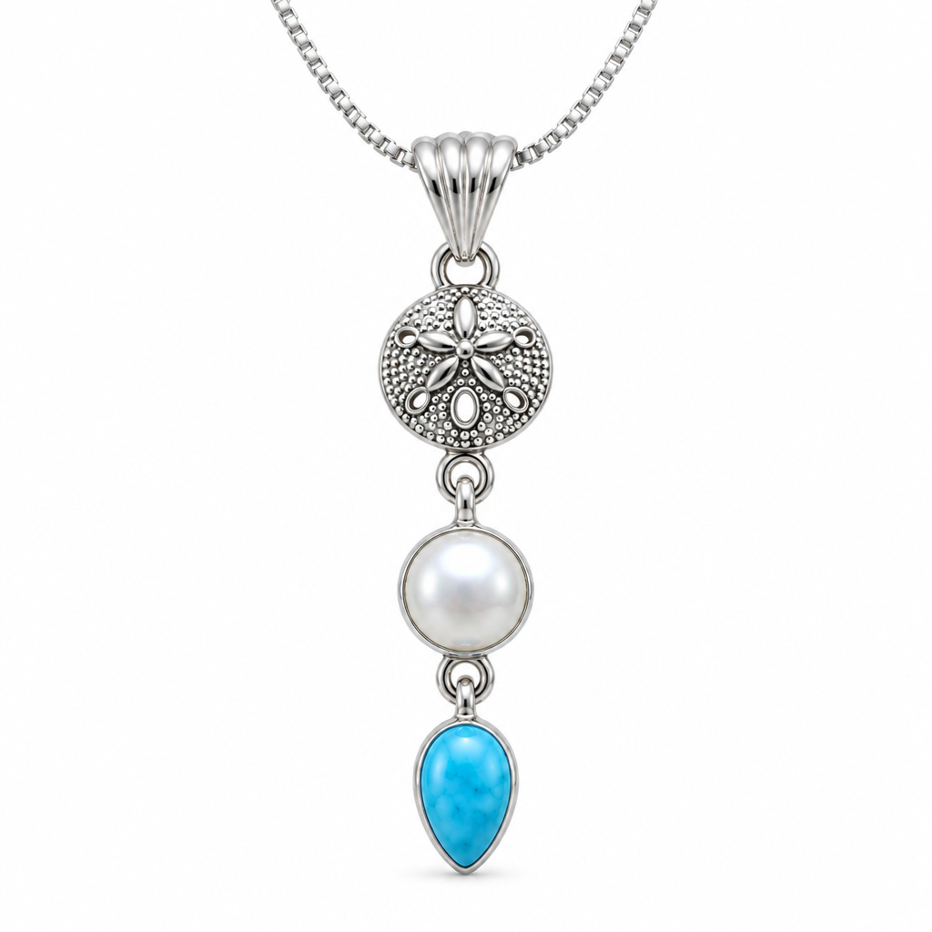 CHAKORE 925 sterling silver freshwater pearl and blue teardrop pendant, shown on a box chain against white.