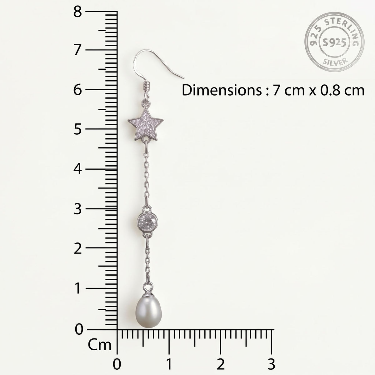 CHAKORE 925 sterling silver star freshwater pearl drop earring beside a ruler, showing dimensions of 7 cm by 0.8 cm.
