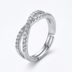 Crossover Infinity 925 Sterling Silver Ring Silver ring with diamond accents on a white background at 45 angle