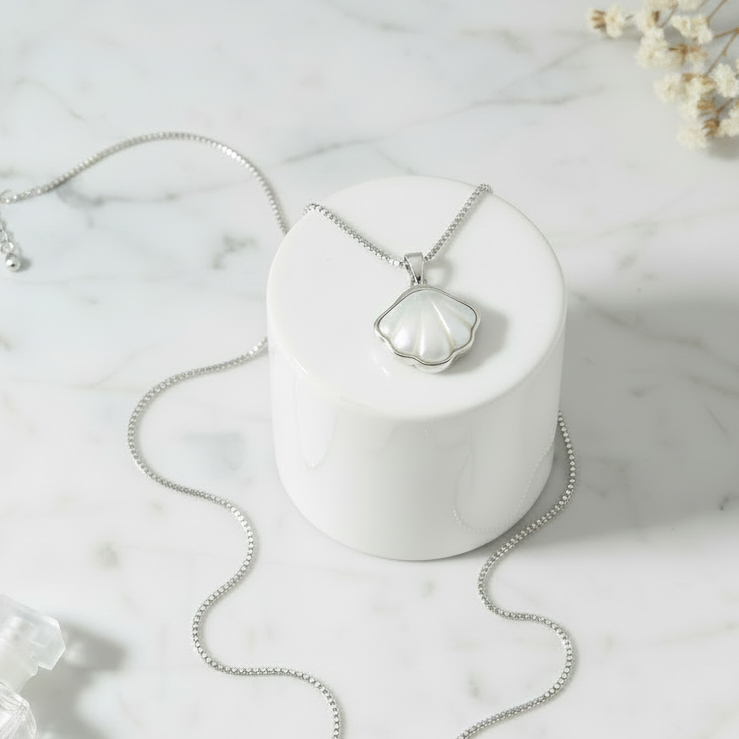 925 Silver Coastal Shell pendant Flat lay – necklace as one piece on marble