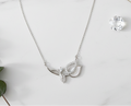 Leaf necklace on marble with props