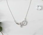 Leaf necklace on marble with props