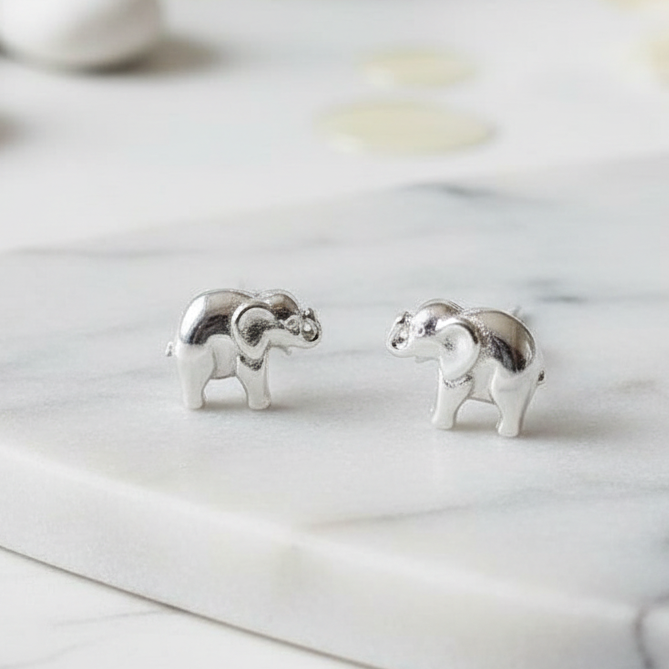 925 Sterling Silver Elephant Stud Earrings on marble surface – CHAKORE