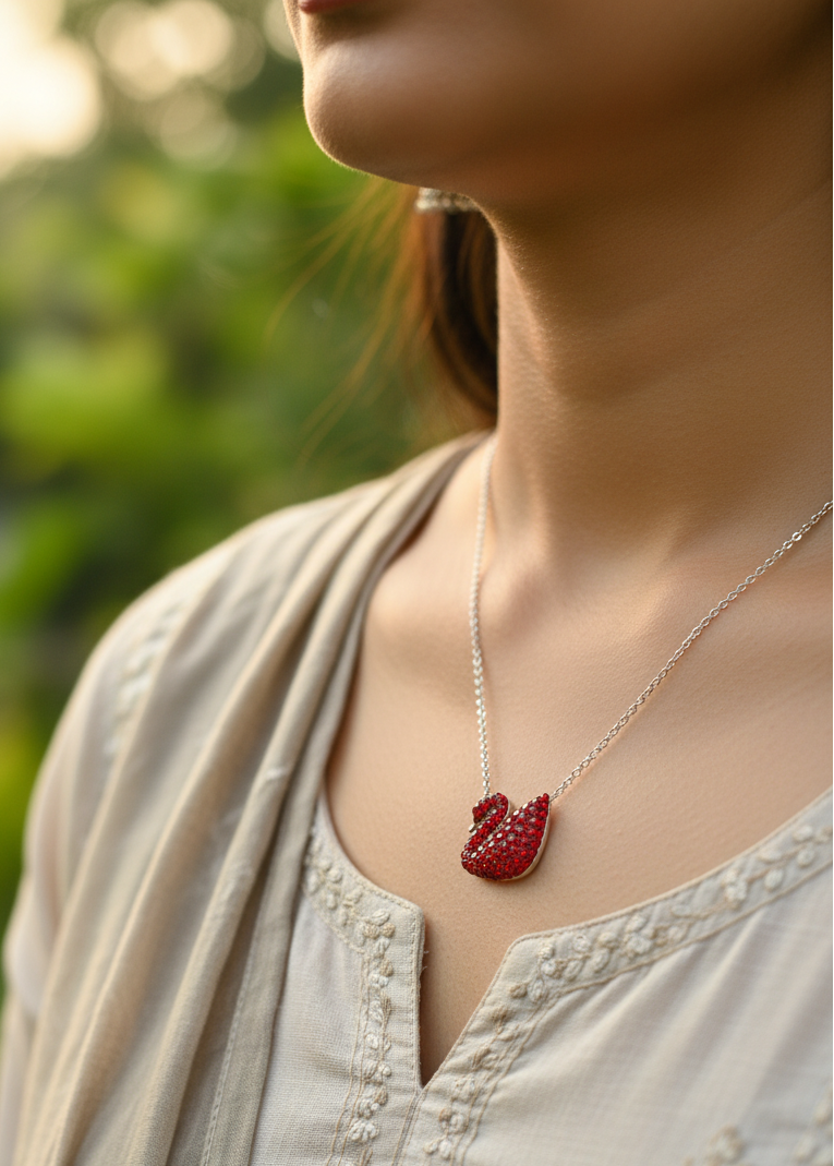 925 silver red swan slider Necklace with a red heart pendant worn by a person against a natural background in indian casual