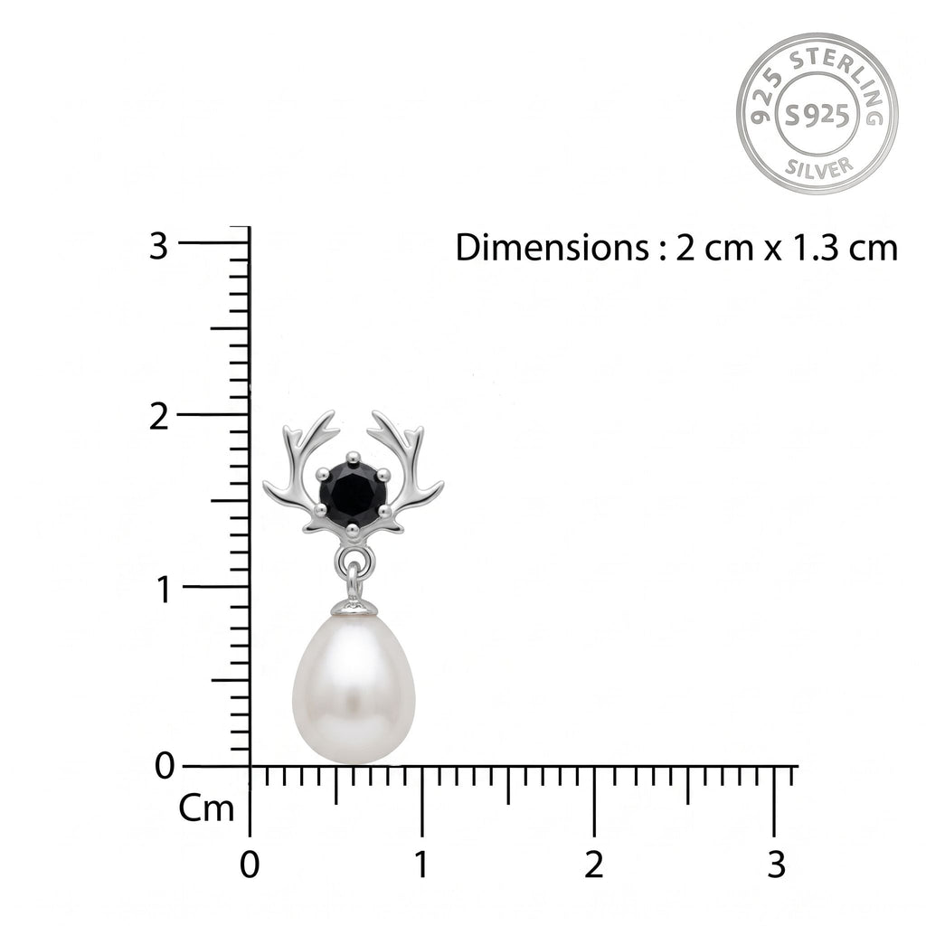 A sterling silver earring by CHAKORE with a black round stone and antler-like branches, hanging from a white teardrop-shaped pearl, shown with a centimeter ruler for scale and a 925 sterling silver stamp on a white background.