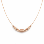 Rose gold beaded 925 silver necklace on seamless white background, shadowless high-end studio jewelry photography