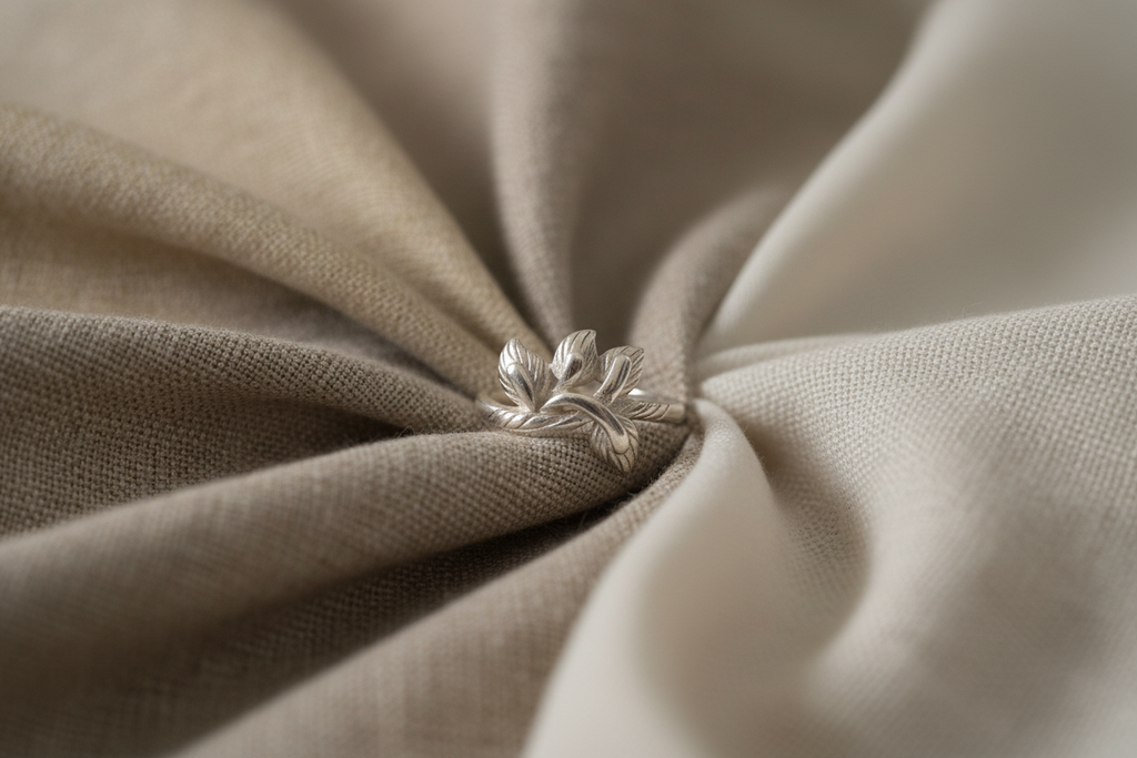 Silver Leaf Ring on Textured Fabric