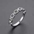 Silver ring on a charcoal grey background