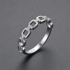 Silver ring on a charcoal grey background