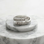 Marble ring holder with a trendy belt 925 sterling silver ring by CHAKORE on a white background