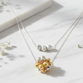 Tri-color 925 sterling silver necklace by CHAKORE – Marble Flat Lay